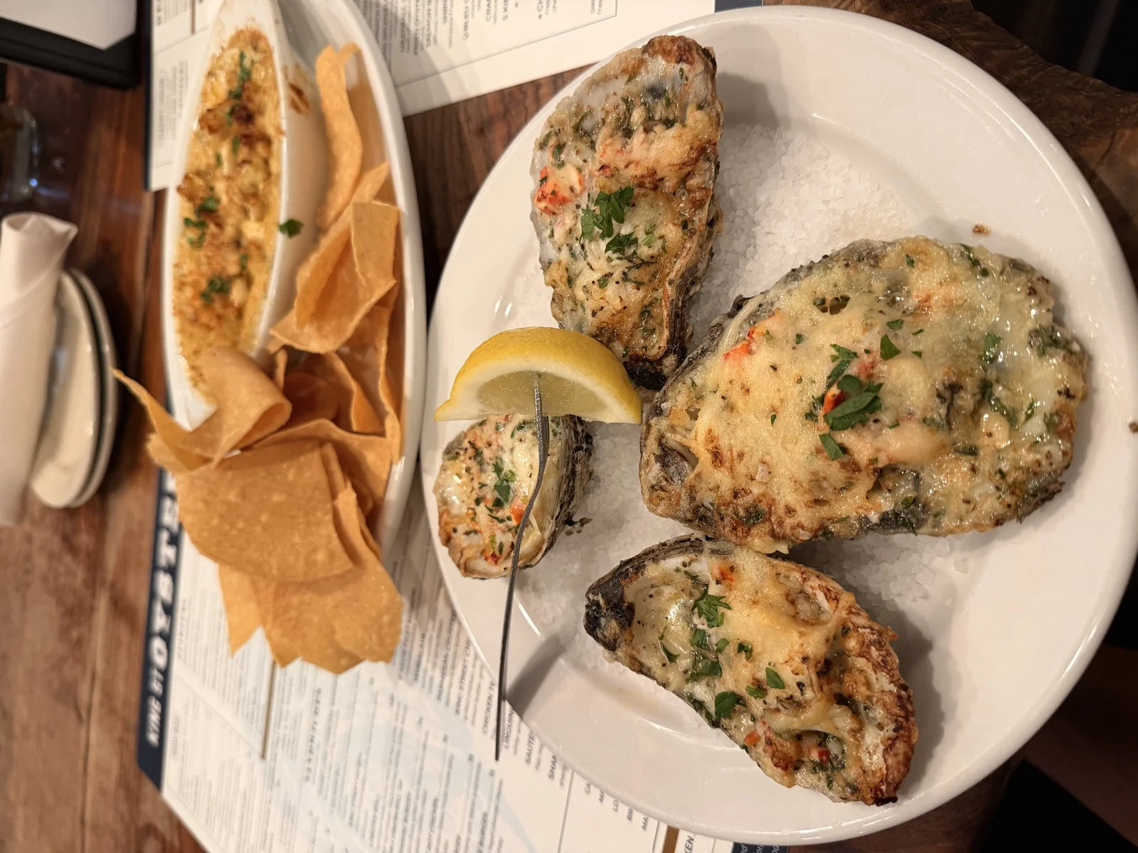 chargrilled oysters w/ herbed butter + parmesan on ice + a small dish of oyster tostada…