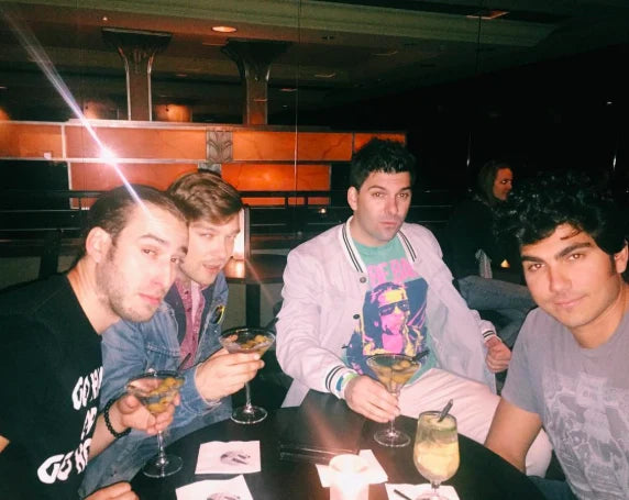 Four cocktails, booth, flash.